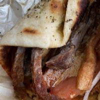 Pita Steak · NY strip, tomato, red onions, fries, paprika, tyrokafteri.