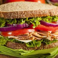 Smoked Turkey Deli Sandwich · Fresh Deli Sandwich made with Smoked Turkey, Romaine lettuce, cheese, and tomatoes.