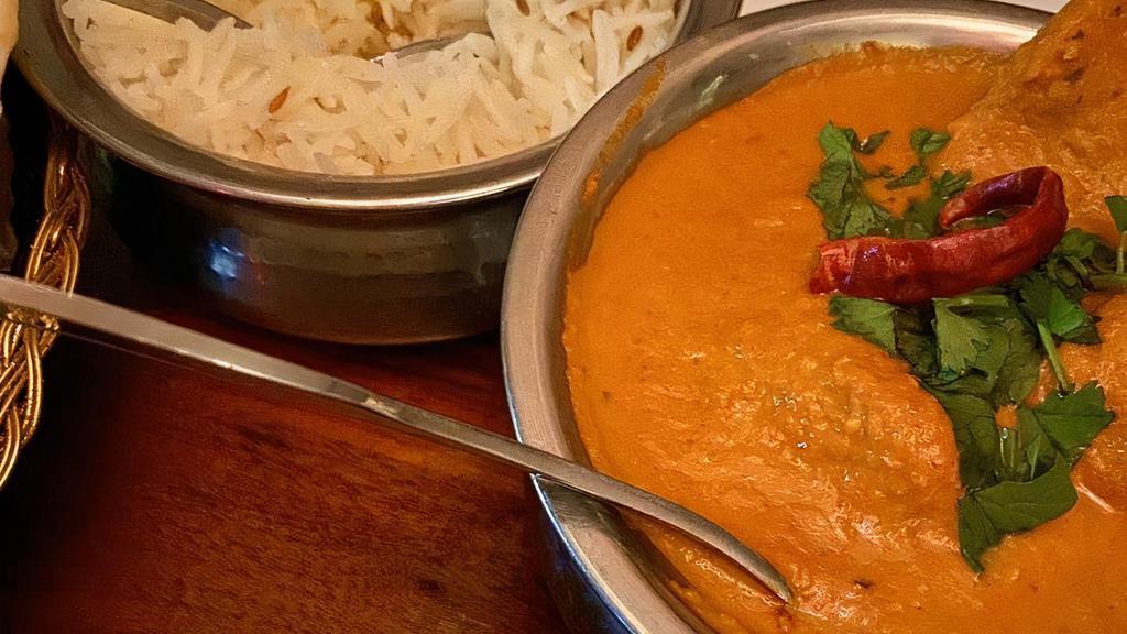 Chicken Tikka Masala · Clay oven cooked white meat, tomato light cream sauce. Served with Basmati rice.