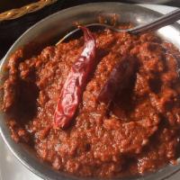 Chicken Vindaloo · Very spicy. Fiery sauce, sun dried Kashmiri red chili, potato, tamarind. Served with Basmati...