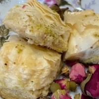 Mini Rose Baklava (2 Pcs) · Rich in Ghee, Mini Roses are delicates but not too sweet! Try it with Syrian or Turkish Coff...