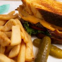Grilled Chicken Deluxe · Grilled with bacon and american cheese on toasted club challah with fries.