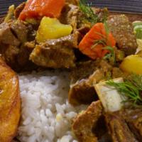 Curried Goat (Small) · Tender chunks of curry-clad goat cooked to the bone. Includes potatoes and carrots for a hea...