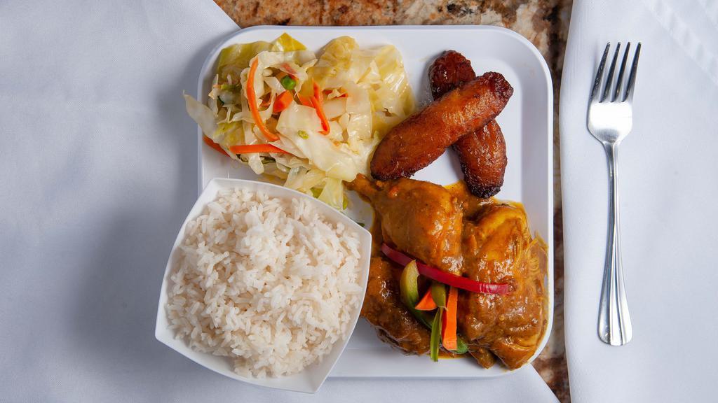 Curry Chicken · Served with rice and peas or white rice and steamed vegetables.