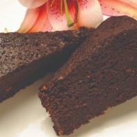 Fruit Cake · A slice of heaven! Rich dark fruit cake soaked in famous Jamaican rum. Decadent and deliciou...