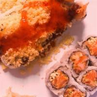 West Orange Roll · Shrimp tempura, cucumber, crab with crunchy, chili sauce.