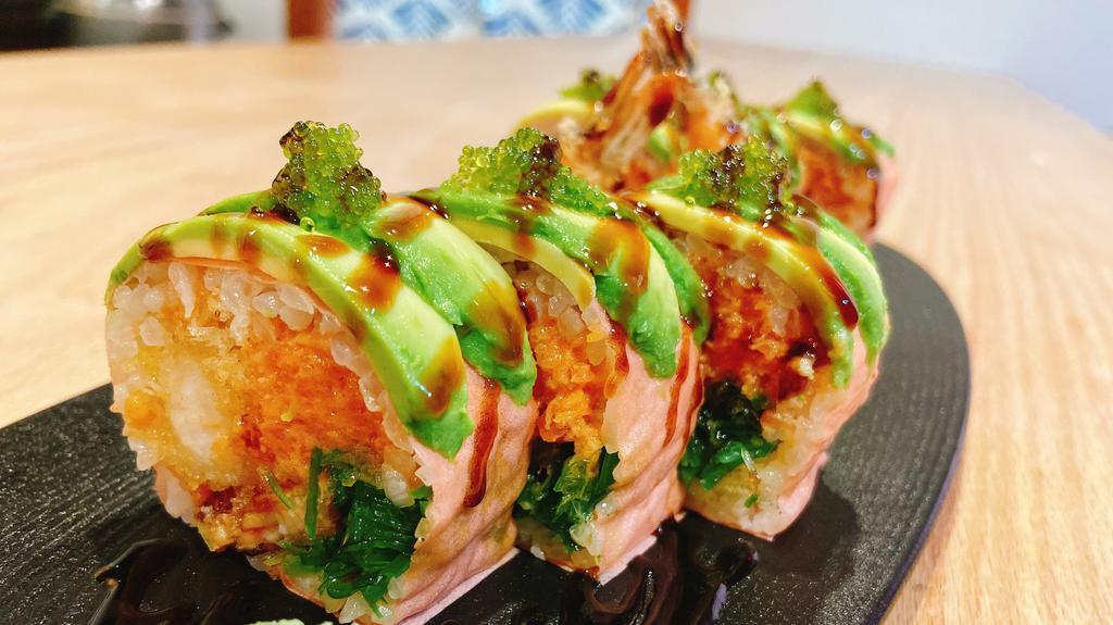 Green Lantern Roll · Shrimp tempura spicy tuna, eel & seaweed salad, topped with avocado, wasabi, tobiko, wrapped with soybean paper & special rice