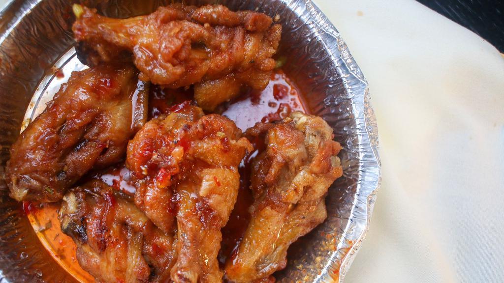 Chicken Wings · Chicken wings sautéedin sweet chili sauce. Hot and spicy. Most popular item.