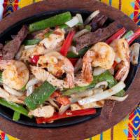 Sizzling Mix Fajita Platter · Served with steak, chicken and shrimp. Comes with Mexican rice, beans, side, pico de gallo, ...
