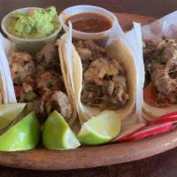 Grilled Steak Tacos · Comes with a soft inside tortilla and a hard shell tortilla stuffed with lettuce, pico de ga...
