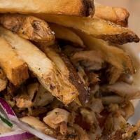 Chicken Gyro Sandwich (Halal) · chicken gyro slow roasted on a vertical broiler wrapped in pita with tomatoes, onions, tzatz...