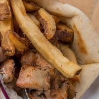 Chicken Souvlaki Pita (Halal) · chunks of grilled, marinated chicken wrapped in pita with tomatoes, onions, tzatziki, topped...