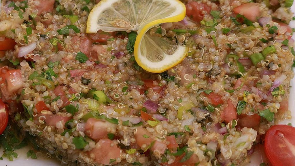 Quinoa Tabbouleh Salad. · Quinoa, Cucumber, Tomatoes, Parsley ,Green Onion, Fresh mint, with Lemon & Olive oil dressing, Served with Pita (E,G, V, D)