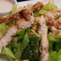 Chicken Caesar Salad · Romaine lettuce, Crouton, Shredded Parmesan cheese topped with Grilled chicken tenders and C...