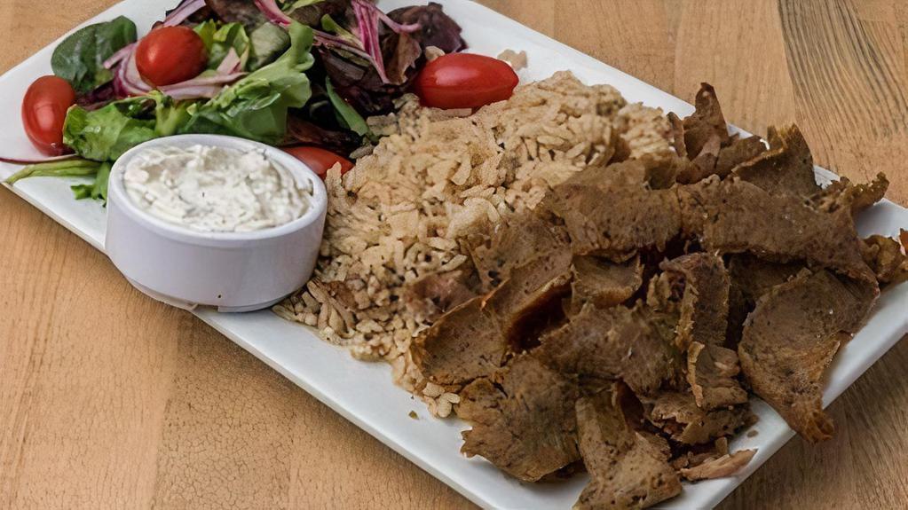 Beef & Lamb Gyro Platter (Halal) · beef & lamb gyro slow roasted on a vertical broiler served with pita bread, house salad, tzatziki & choice of side (D,E)