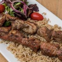 Lamb Souvlaki Platter (Halal) · Marinated Lamb chunks served with house salad & choice of Rice or Fries. Tzatziki & pita bre...