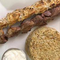 Athenian Dou Platter · Lamb & Chicken skewers, served with house salad & choice of Rice or Fries. Tzatziki & pita b...