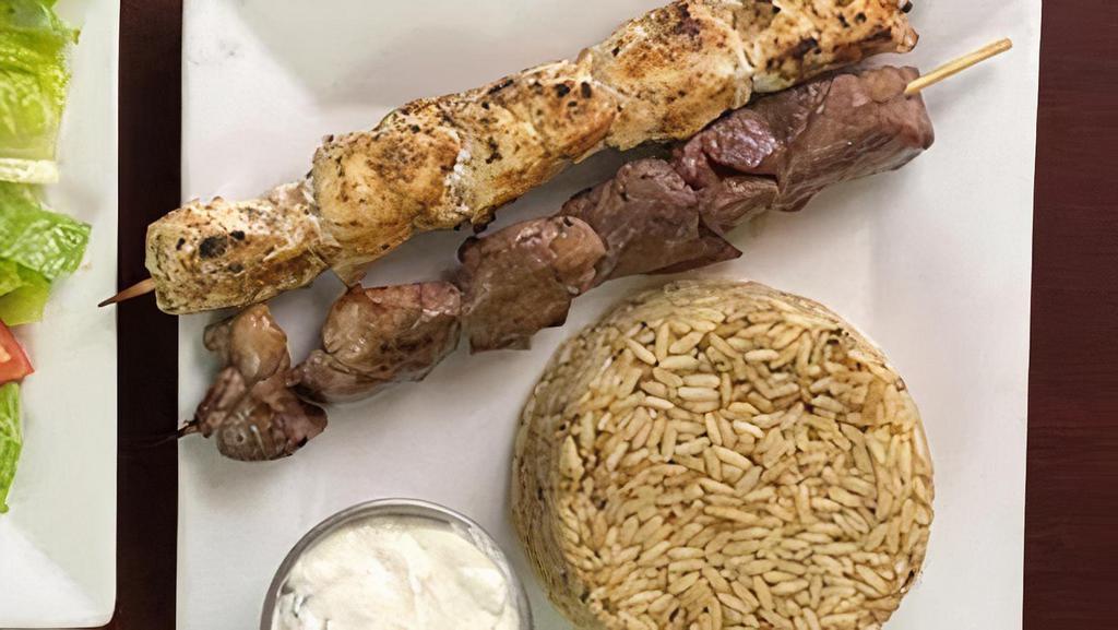 Athenian Dou Platter · Lamb & Chicken skewers, served with house salad & choice of Rice or Fries. Tzatziki & pita bread, .(E,G, D)