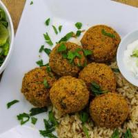 Falafel Platter · 6 falafel patties served with house salad & choice of Rice or Fries. Tzatziki & pita bread (...