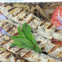 Greek Feast For 4 · beef & lamb gyro, chicken gyro, 4 chicken Souvlaki  skewers, served with Rice, 4 pita bread ...