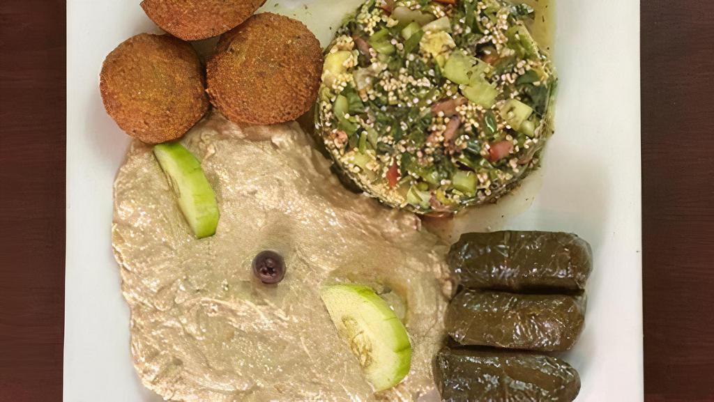 Mediterranean Combo · Quinoa Tabbouleh Salad, Eggplant dip, Falafel & Grape Leaves. (D, E, V,
)