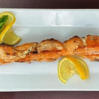 Salmon Souvlaki Stick · Grilled marinated Salmon cubes with fresh peppers on a skewer (D,E,G)