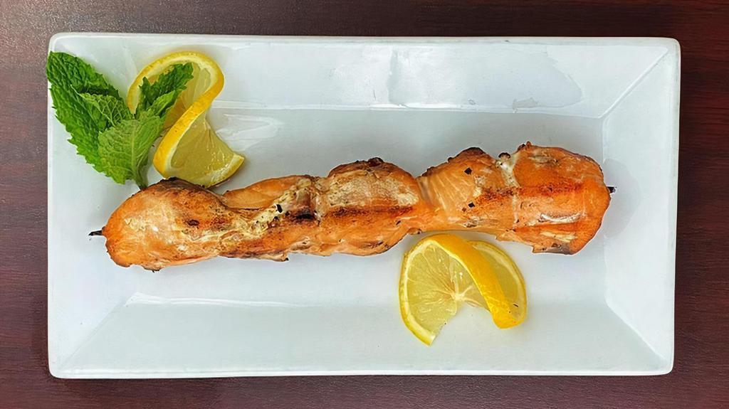Salmon Souvlaki Stick · Grilled marinated Salmon cubes with fresh peppers on a skewer (D,E,G)