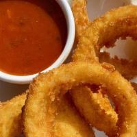 Onion Rings Steak Cut · Fried Jumbo Onion Rings, Served with Our Homemade Tomato Sauce (V)