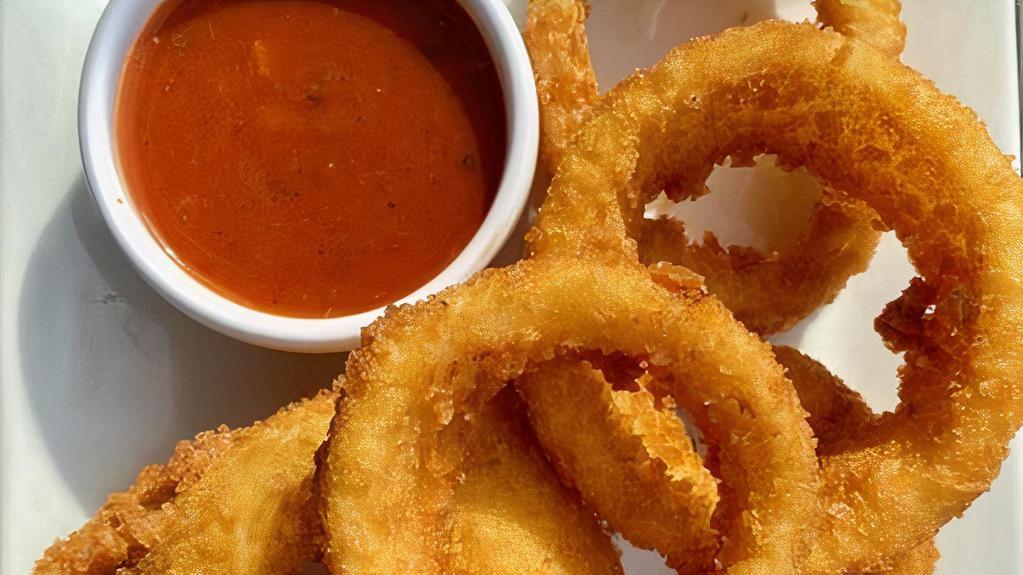 Onion Rings Steak Cut · Fried Jumbo Onion Rings, Served with Our Homemade Tomato Sauce (V)