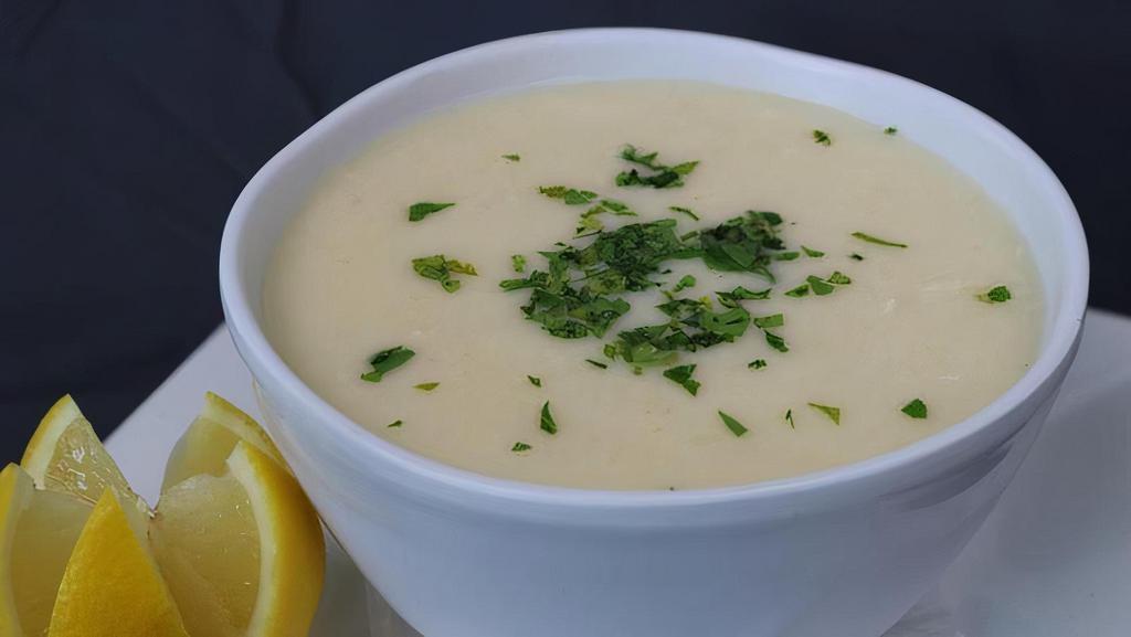 Avgolemono · Greek style egg lemon chicken soup (16oz bowl) (D)