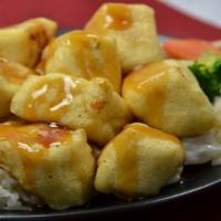 Tofu Teriyaki · Served with mixed vegetables and steamed rice.