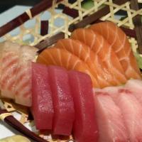 Sashimi Deluxe · 4 pcs of Salmon, 4 pcs of Yellowtail, 3 pcs of White Fish, and 3 pcs of Tuna.