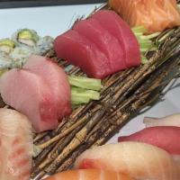 Sushi Sashimi Combo · 8 pcs of California roll, 10 pcs of sashimi (tuna, salmon, white fish, yellowtail) and 4 pcs...