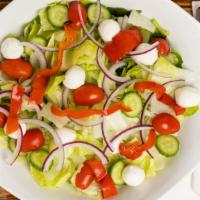 House Salad · Mixed lettuce, red onions, grape tomatoes, carrots, cucumbers & Perline mozzarella