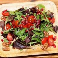 Arugula Salad · Fresh baby arugula, prosciutto Di Parma, grape tomatoes, red onions, Parmesan cheese & organ...