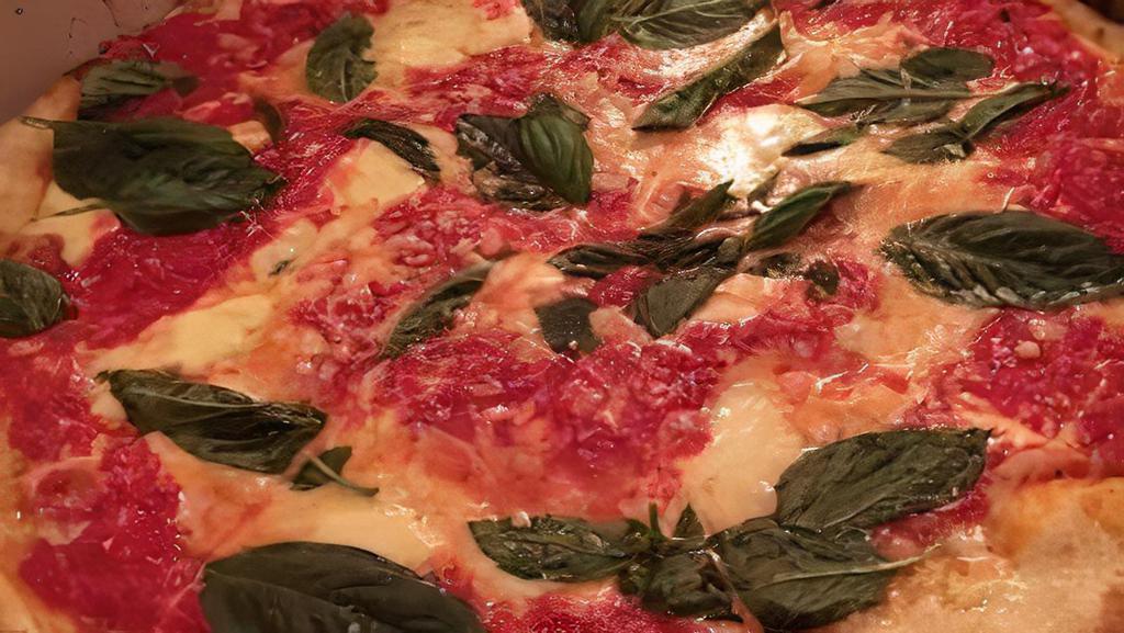Margherita Pizza · D.O.P tomato sauce, fresh Mozzarella, basil, Parmigiano Reggiano, D.O.P., EVOO.