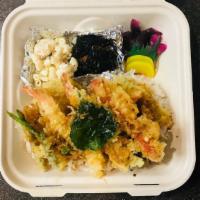 Ten Don 天丼 · Shrimp and vegetable Tempura  drizzle with home made tempura sauce over rice.

All vegetable...