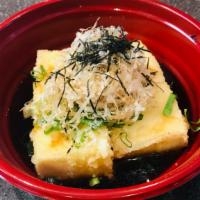 Agedashi Tofu 揚げ出し豆腐 · Deep fried Tofu. Crispy deep fried tofu served in flavorful tsuyu sauce with grated radish, ...