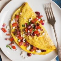 Greek Omelet · Feta cheese, tomatoes, red onions, and black olives.