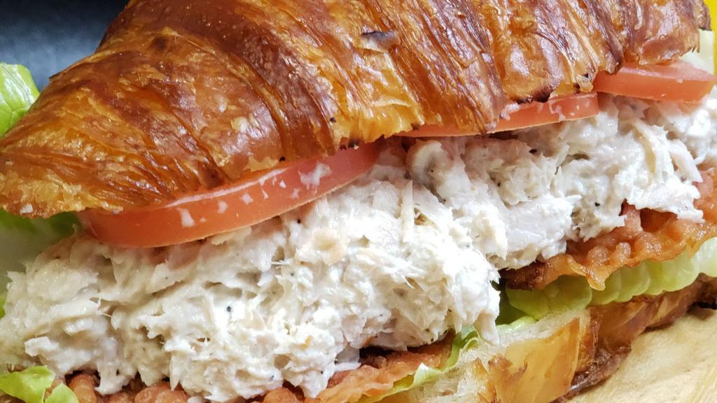 Albacore Tuna Sandwich · Seasoned all white albacore tuna creamy mayo, topped with lettuce tomato and bacon served on a scratch made croissant.