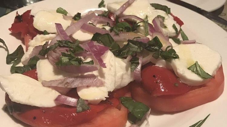 Fresh Mozzarella Salad · Beefsteak tomato, fresh bocconcini mozzarella, Roasted Red Peppers, Red onion and fresh basil drizzled with extra virgin olive oil.