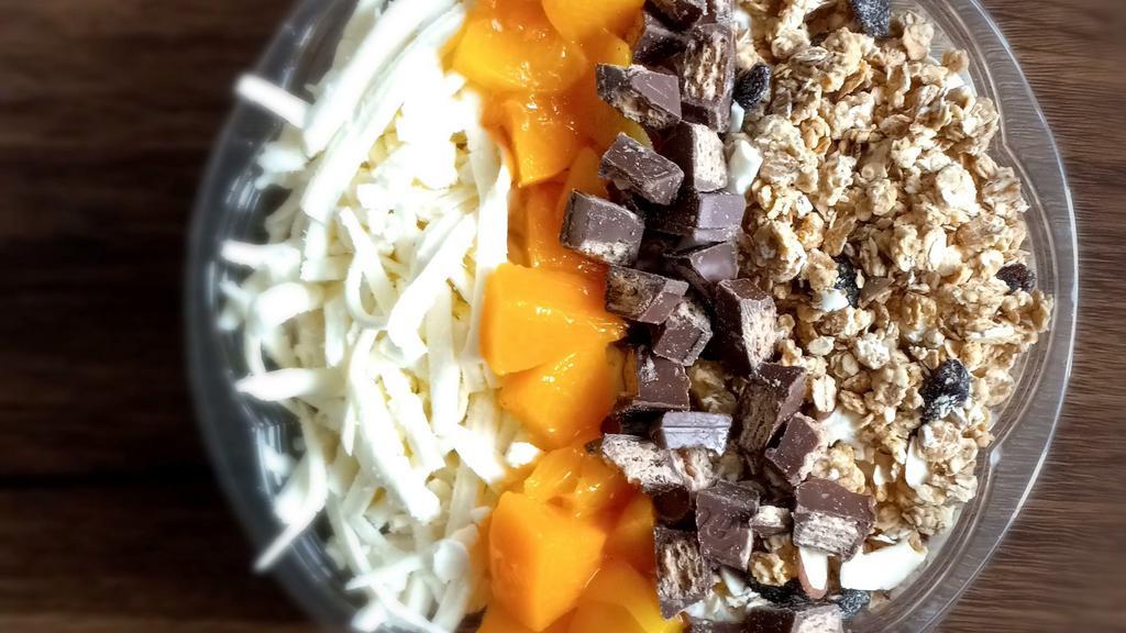 Sunset · Fresh fruits mix with homemade cream topped with peaches, coconut flakes, granola, chocolate wafers pieces, oreo cookies pieces and honey.