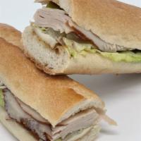 Turkey Brie & Apple Ficelle · Turkey, Brie cheese, granny smith apple, honey mustard and Green Leaf lettuce on a ficelle.