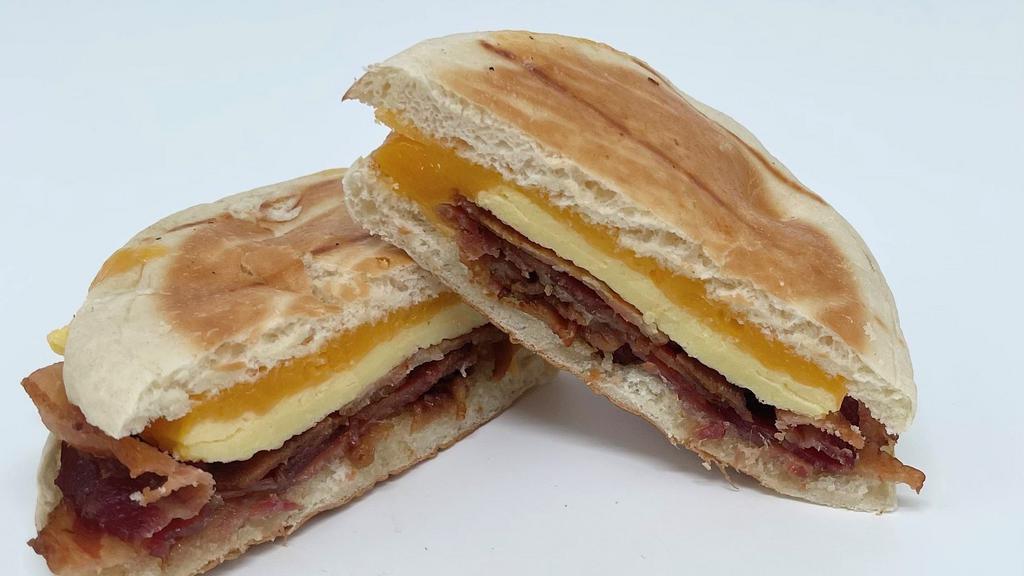 English Muffin With Egg & Bacon · Toasted English Muffin with Bacon, Egg & Cheddar Cheese.