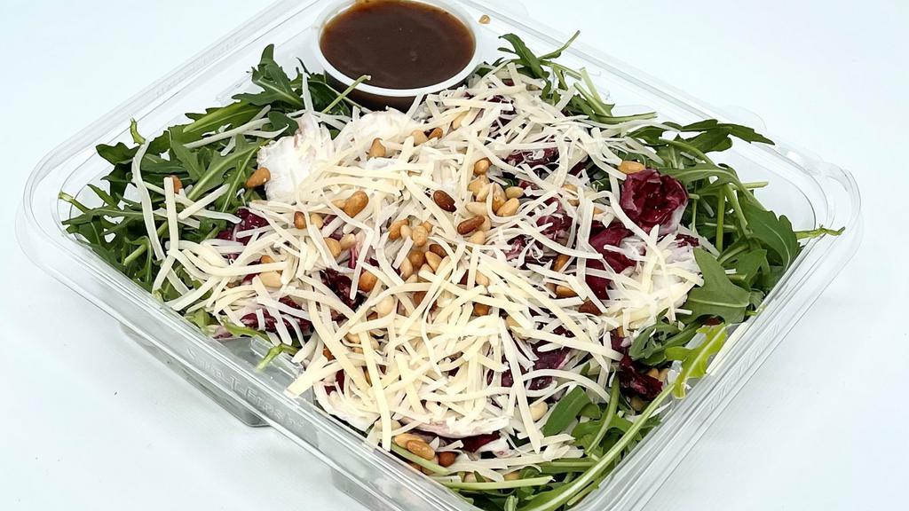 Tri Color Salad With Balsamic Vinaigrette · Shredded Parmesan, toasted pine nuts and balsamic vinaigrette over a mixture of arugula, radicchio and endive.