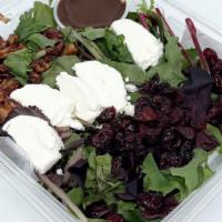 Mixed Greens With Goat Cheese Salad · Mixed Field Greens, Caramelized Walnuts, Dried Cranberries, Goat Cheese Balsamic Vinaigrette.