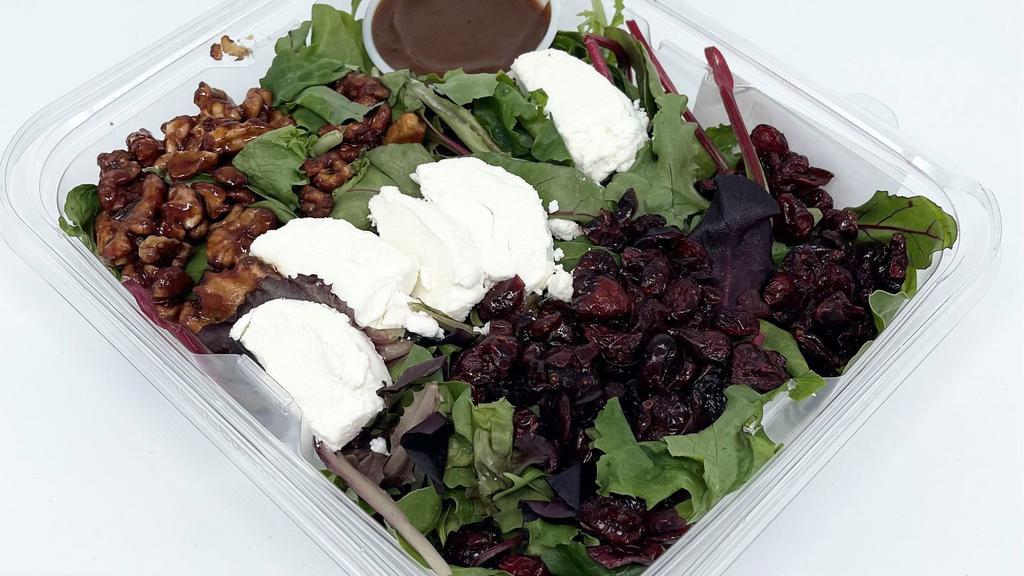 Mixed Greens With Goat Cheese Salad · Mixed Field Greens, Caramelized Walnuts, Dried Cranberries, Goat Cheese Balsamic Vinaigrette.