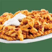 Loaded Waffle Fries · There’s a reason you keep coming back for more. Crispy waffle fries loaded up with melted Ch...
