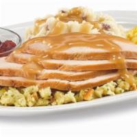 Homestyle Turkey Dinner · Hand-carved turkey breast over a bed of flavorful. stuffing covered with turkey gravy. Serve...
