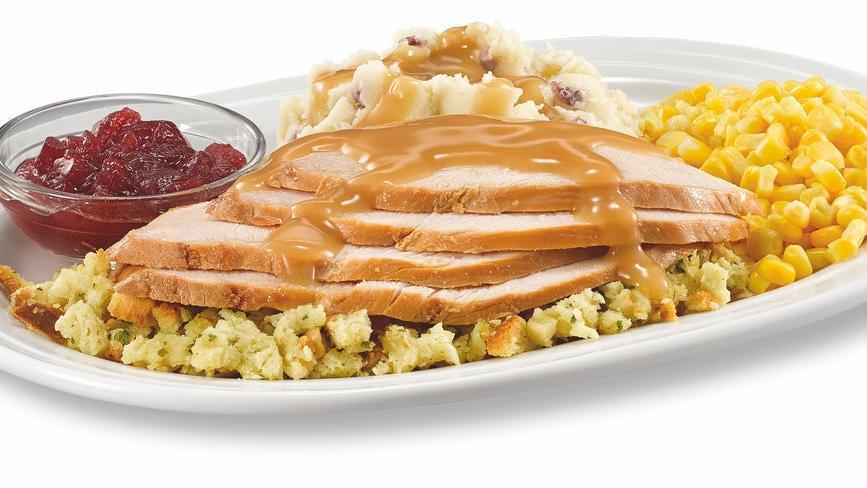 Homestyle Turkey Dinner · Hand-carved turkey breast over a bed of flavorful. stuffing covered with turkey gravy. Served with garlic red skin mashed potatoes, corn and cranberry sauce.